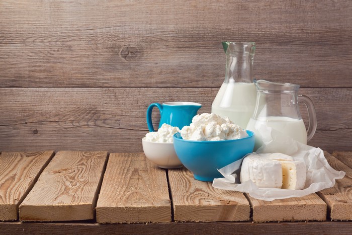 Dairy products on wooden planks