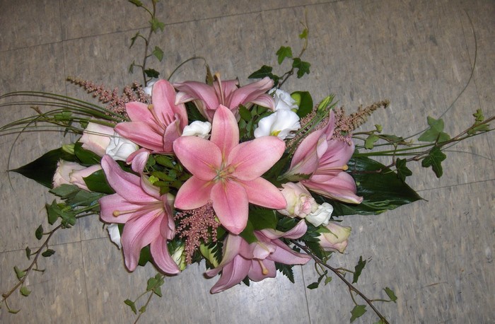 Pink lilies and roses floral arrangement