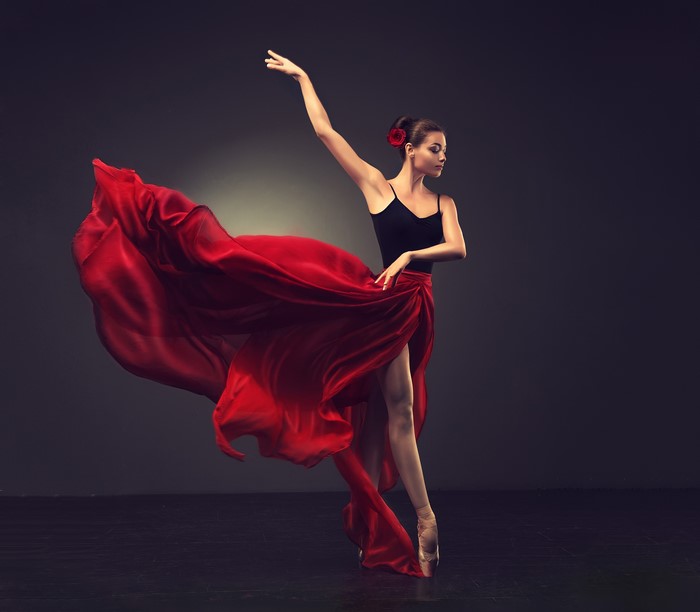 Ballerina in red skirt dancing