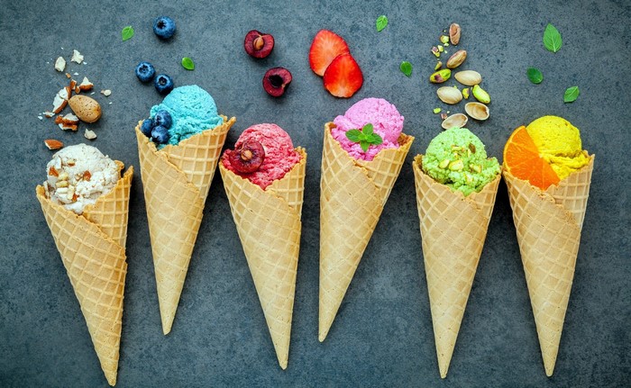 Assortment of ice cream cones with toppings