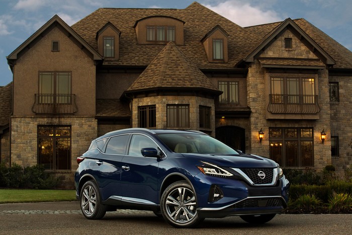 Blue 2019 Nissan Murano in front of a large house