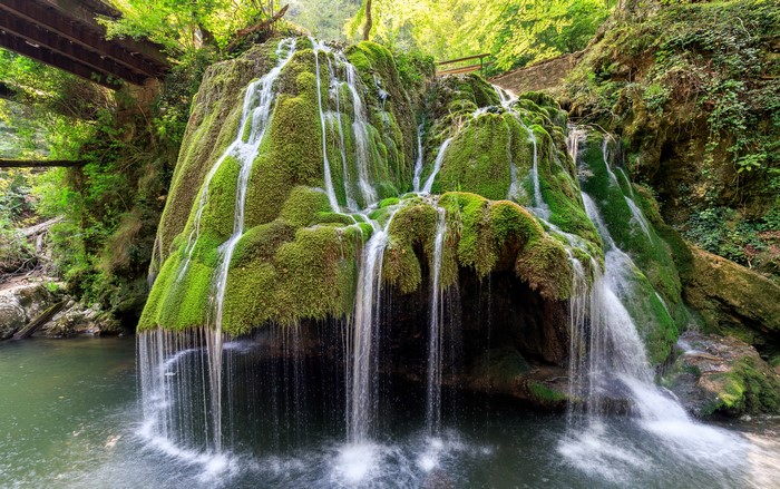 Bigar Waterfall in Romania covered in moss