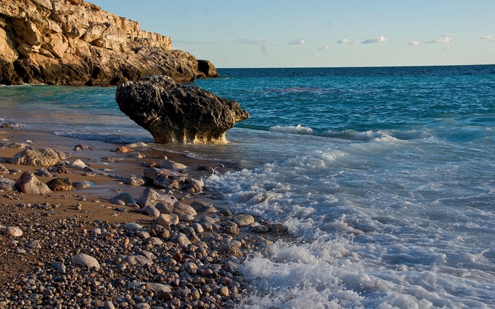 Rocky beach with waves crashing on shore
