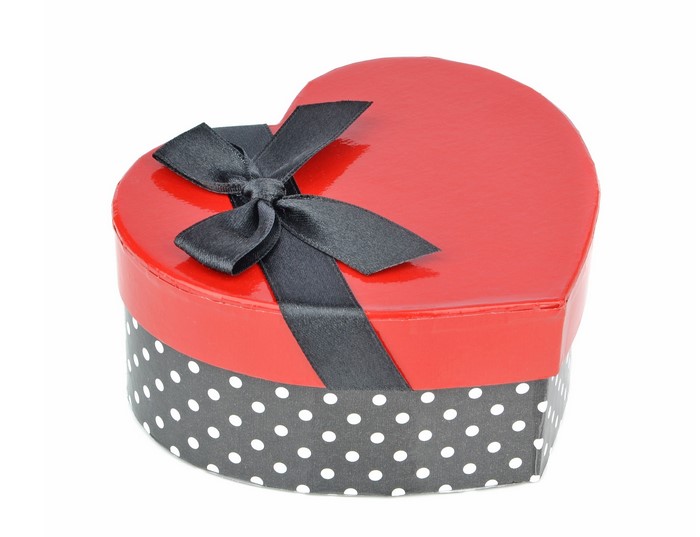 Red heart-shaped gift box with black polka dots and bow
