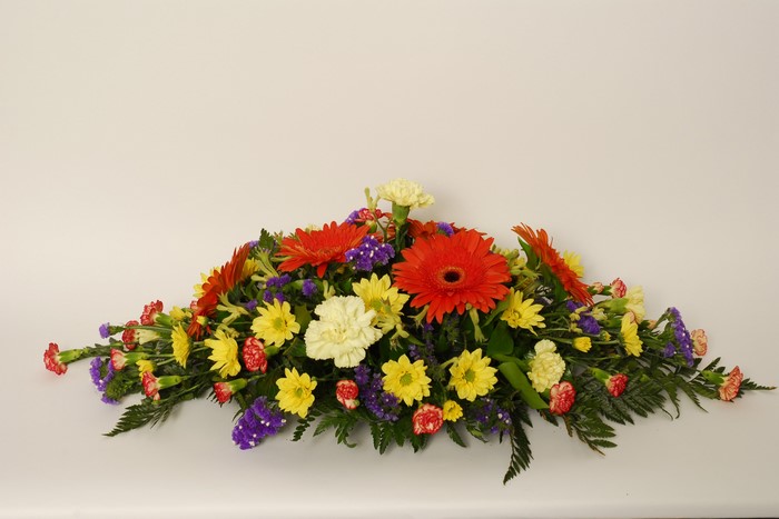 Colorful floral arrangement with gerberas and chrysanthemums