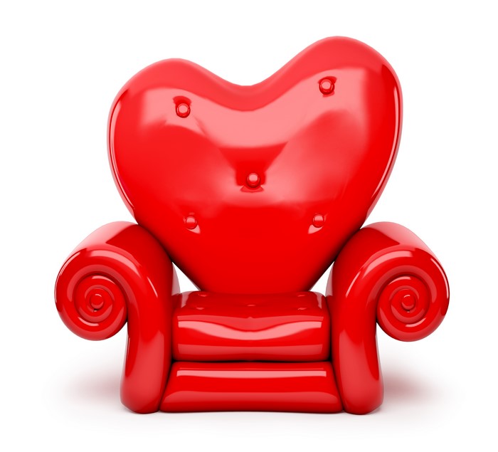 Red heart-shaped armchair on a white background