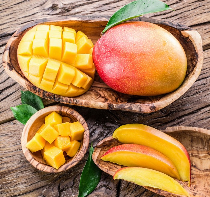 Mangoes on wooden planks