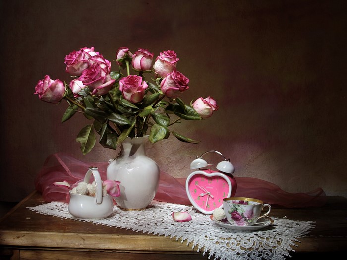 Still-life with roses, clock, sweets, vase, and cup