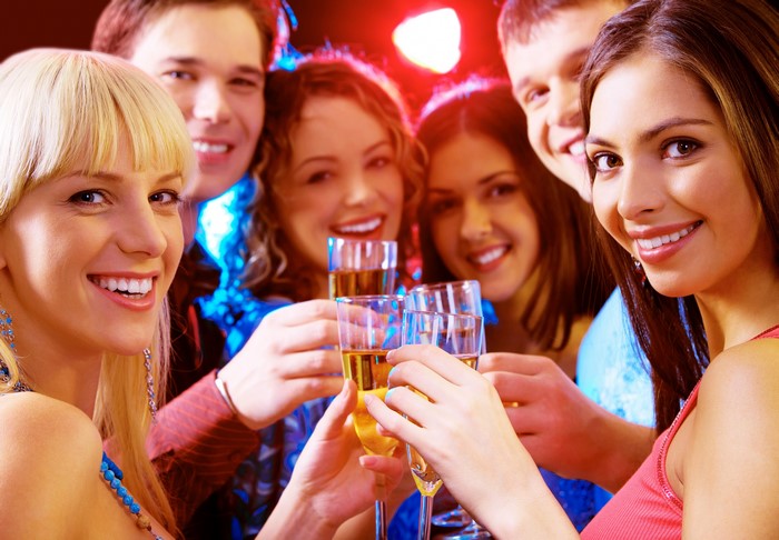 Group of friends toasting with champagne