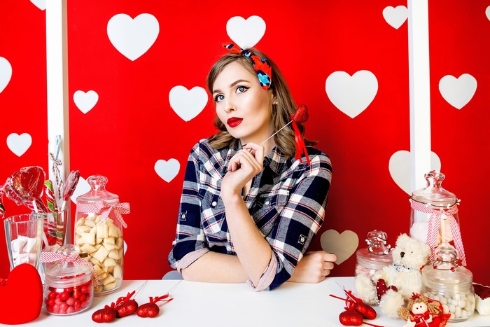 Woman in pin-up style with Valentine's Day sweets