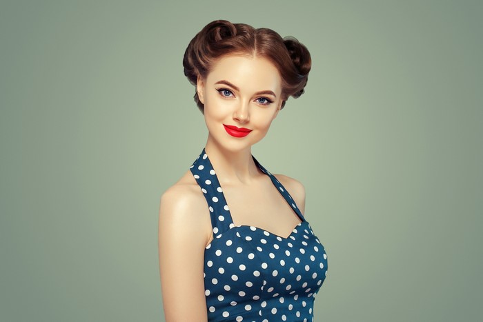 Woman with retro hairstyle and polka dot dress