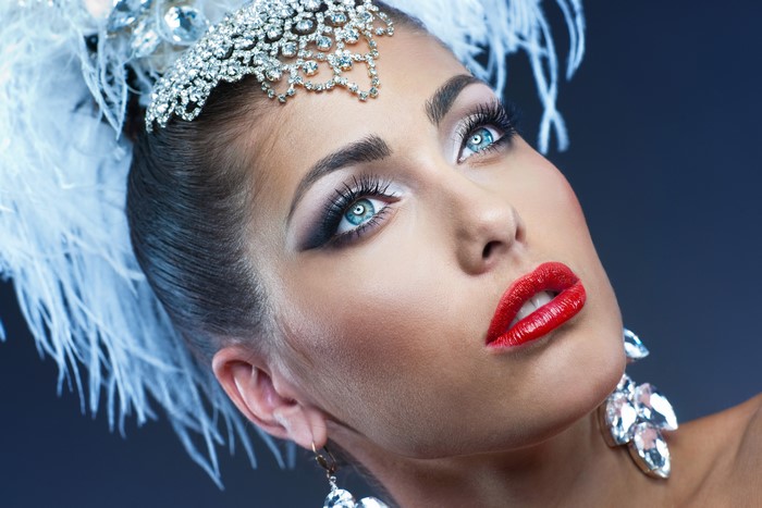 Woman with elaborate makeup and jewelry