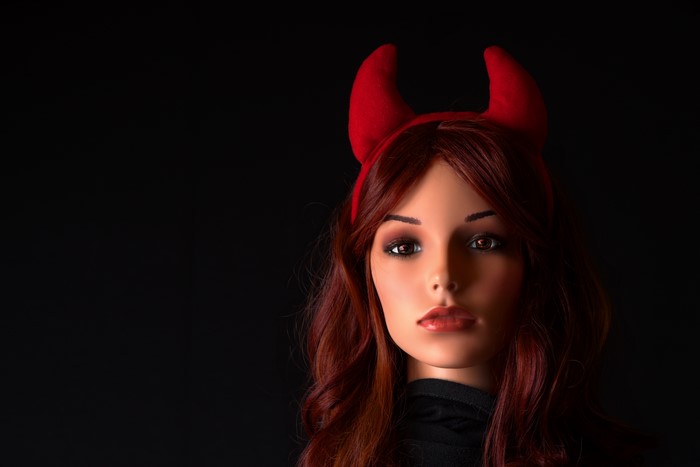 Mannequin with red devil horns and red hair