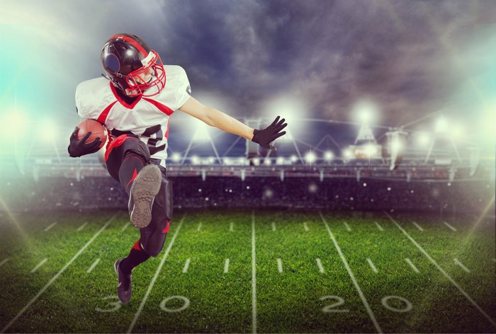 American football player running with ball