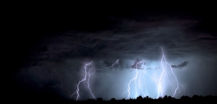 Lightning strikes during a thunderstorm at night