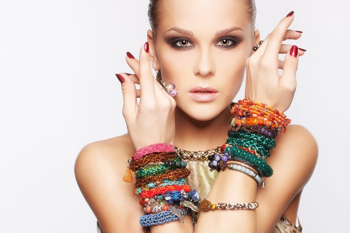Woman with multiple bracelets and rings