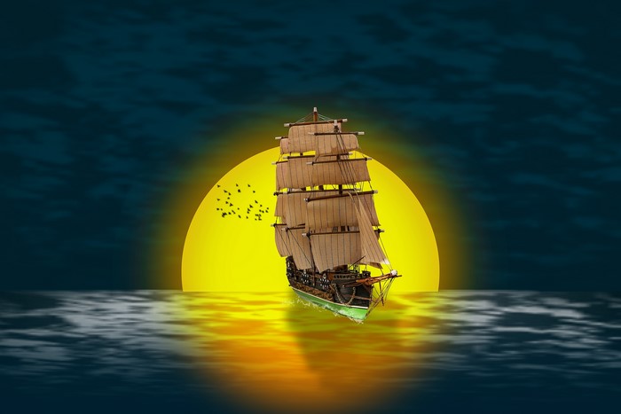 Sailing Ship on the Ocean at Sunset