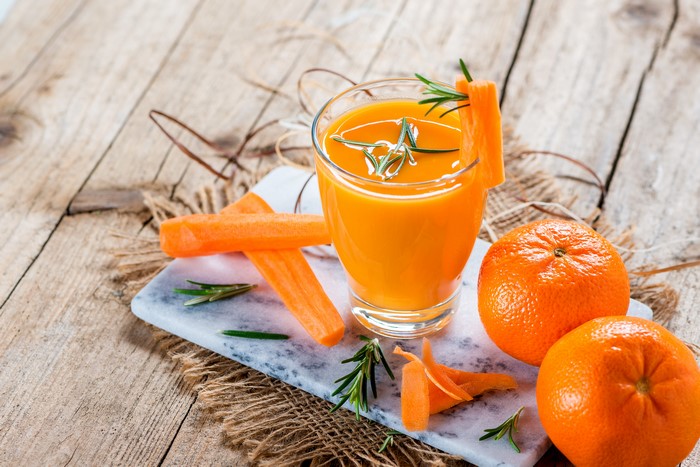 Carrot and orange juice with garnishes