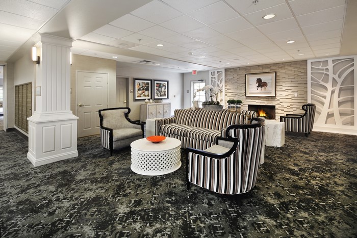 Living room interior design with sofa and armchairs