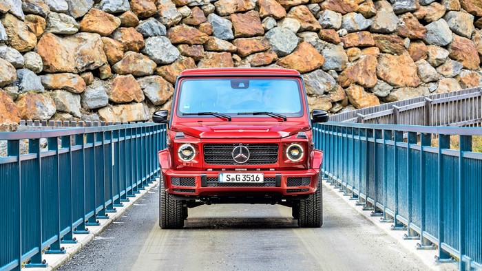 Red Mercedes-Benz G-Class G 350 d AMG Line on a bridge