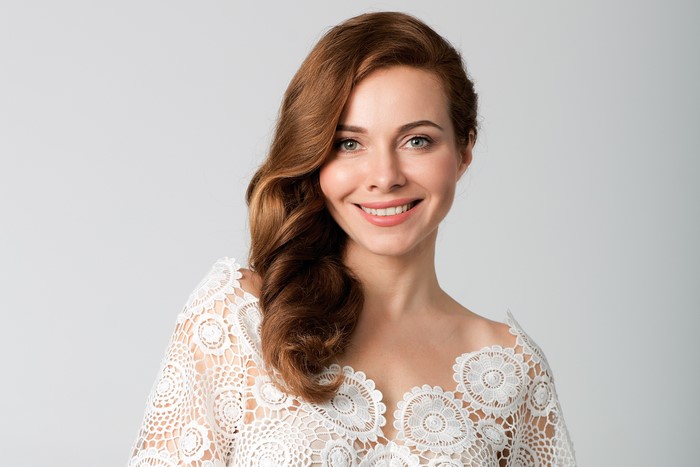 Ekaterina Guseva with brown hair smiling
