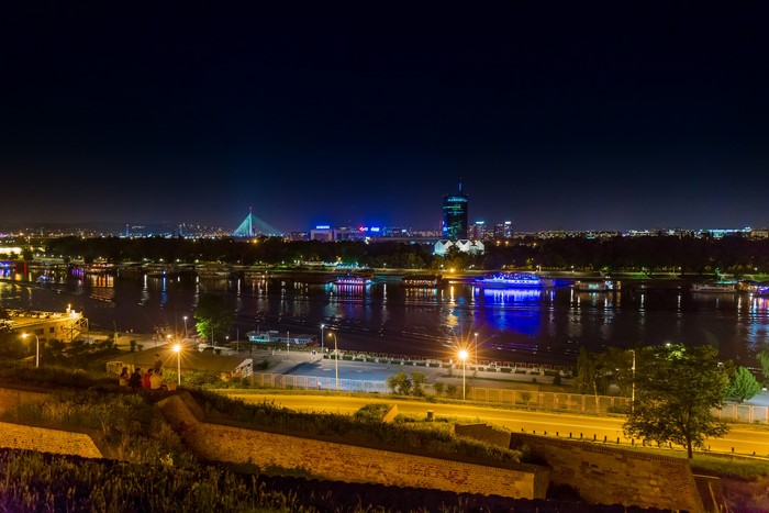 Belgrade cityscape at night with river and bridge