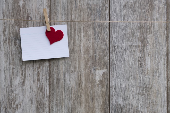 Red heart on paper attached to clothesline