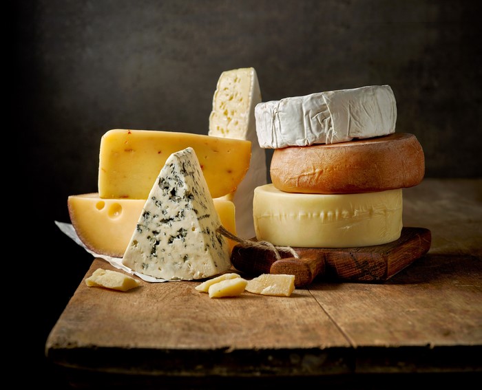 Assortment of Cheeses on Wooden Table