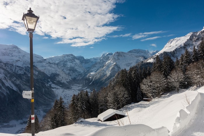 Braunwald, Switzerland: Snowy Mountains and Street Lamp