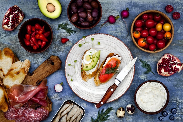 Assortment of appetizers with bread, meats, and vegetables