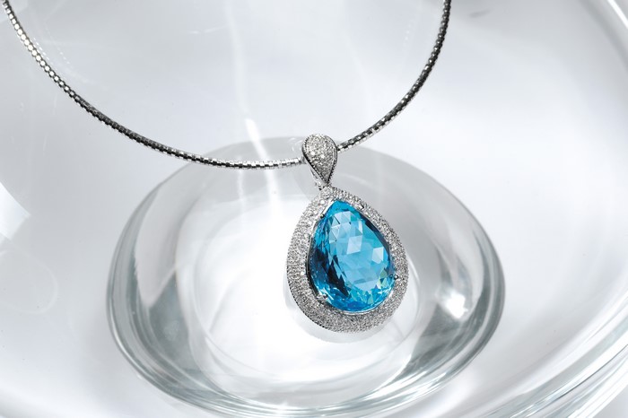 Pear-shaped blue topaz pendant necklace with diamonds