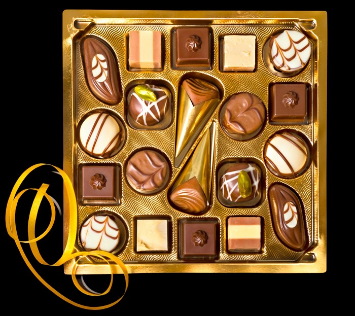 Box of assorted chocolates with yellow ribbon