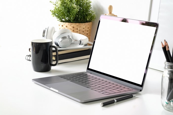 Laptop, Headphones, and Coffee Mug on Desk