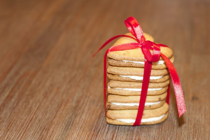 Stack of heart-shaped cookies tied with red ribbon