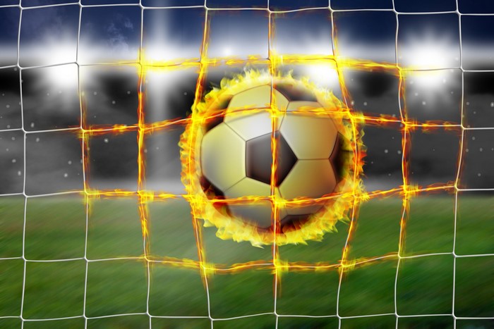 Soccer ball on fire in a net