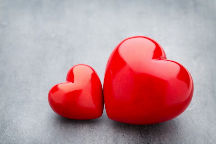 Two red hearts on a gray background