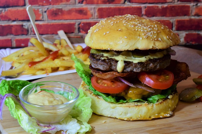 Hamburger with fries and dipping sauce