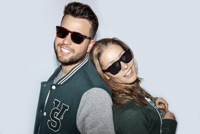 Man and woman wearing sunglasses and jackets