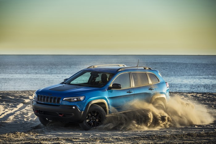 Blue 2019 Jeep Cherokee Trailhawk on a Beach
