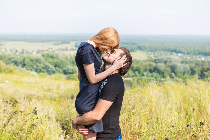 Couple in love kissing outdoors