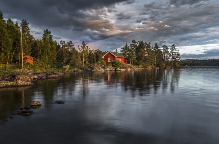 Red house by a lake in Norway