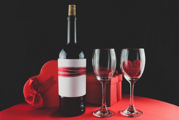 Valentine's Day wine bottle with gifts and stemware
