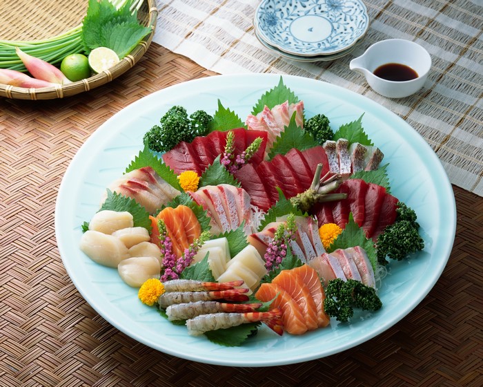 Sashimi platter with assorted seafood and garnishes