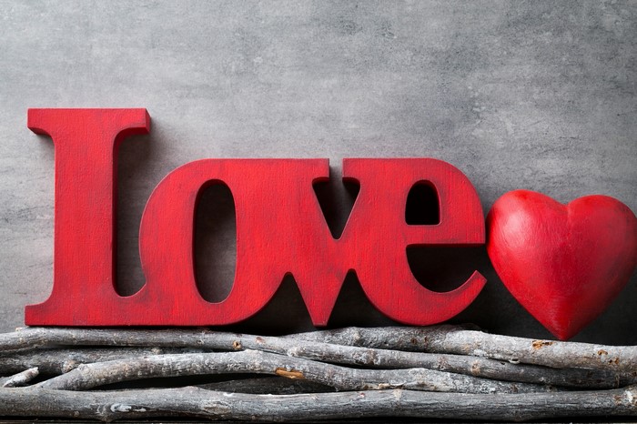 Red wooden letters spelling LOVE with a heart