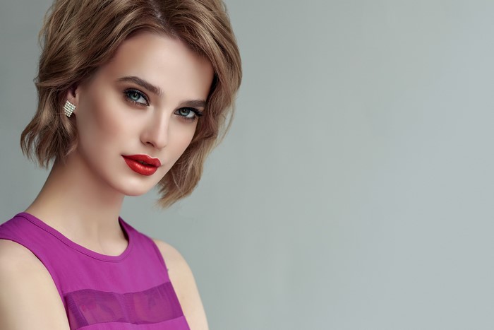 Woman with blonde hair and red lipstick