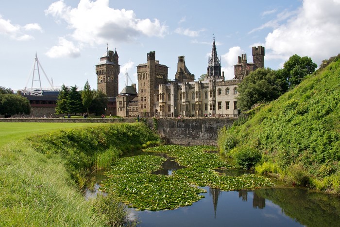Cardiff Castle with pond and stadium in background