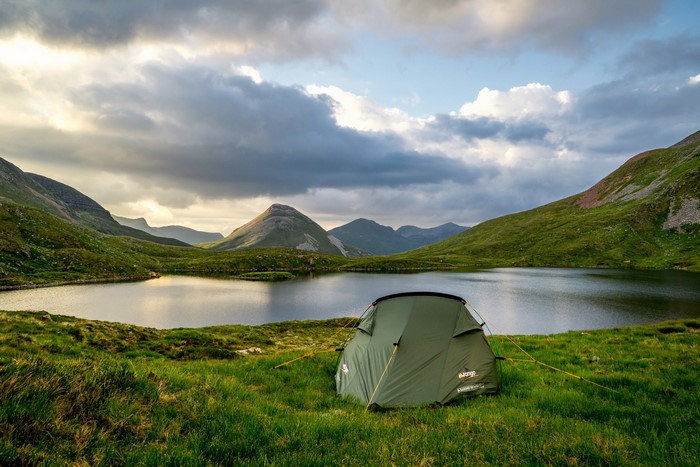 Tent by a lake in the Scottish Highlands