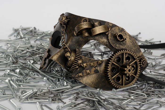 Steampunk mask with gears and skulls on screws