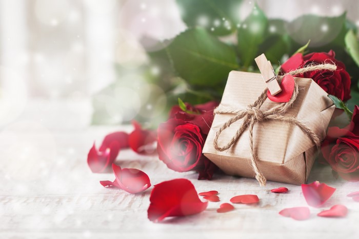 Valentine's Day gift with red roses and petals