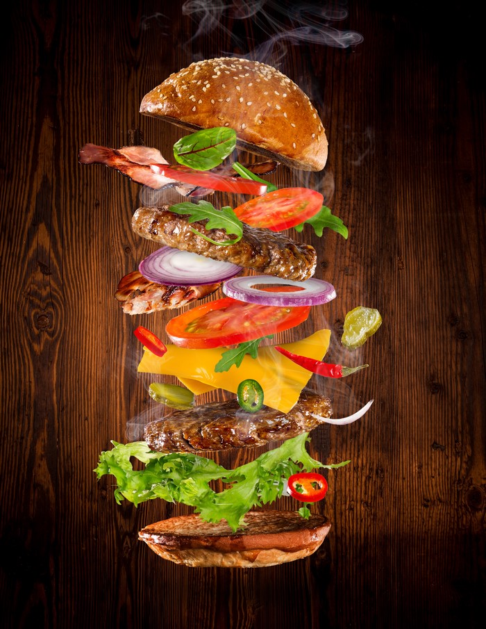 Deconstructed hamburger with flying ingredients